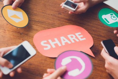 Phones gather round a thought-bubble shaped sign that reads
