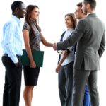 Young business professionals shaking hands and smiling